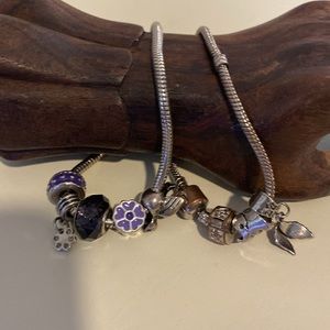 COSTUME Charm Bracelets, set of two. Silver tone & one w/ purple accents.